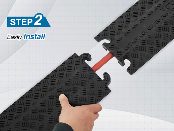 hand connecting VEVOR speed bump pieces with embedded cable, step 2 installation guide
