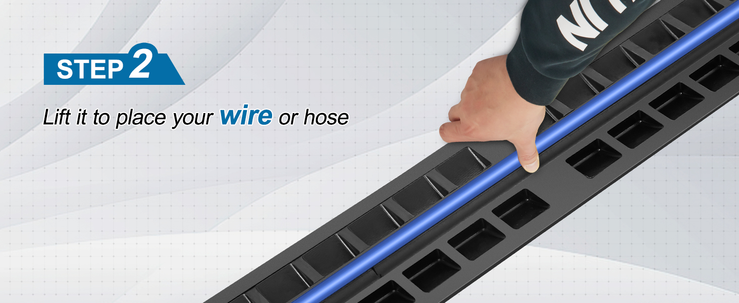 hand lifting VEVOR cable protector ramp to place a blue wire or hose. step 2 instructions displayed.