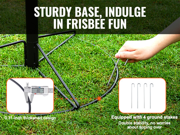 sturdy base of VEVOR disc golf basket on grass, secured with ground stakes and a hand placing a stake.