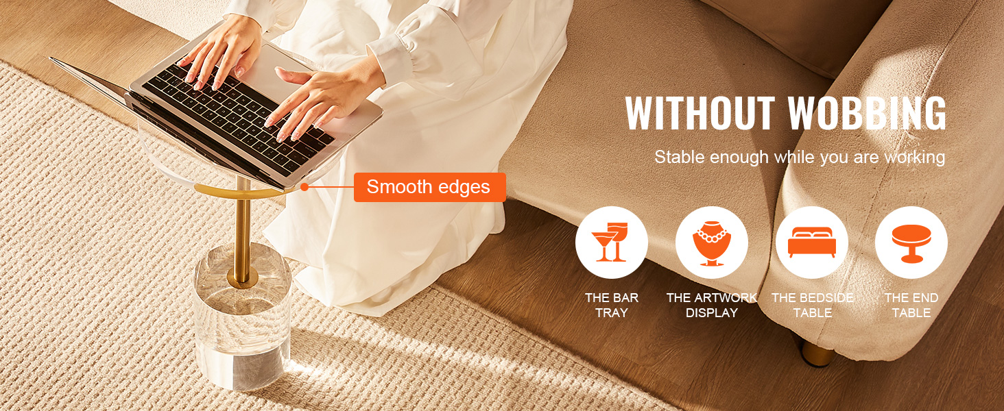 person using a laptop on a stable, smooth-edged VEVOR acrylic end table beside a sofa.