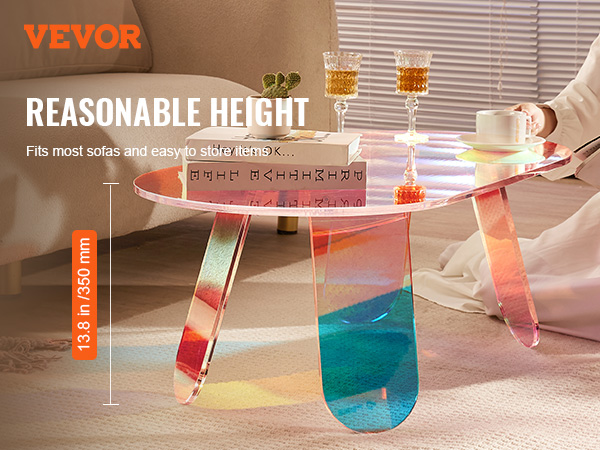 VEVOR acrylic coffee table in living room with books, cups, and comfortable ambiance.