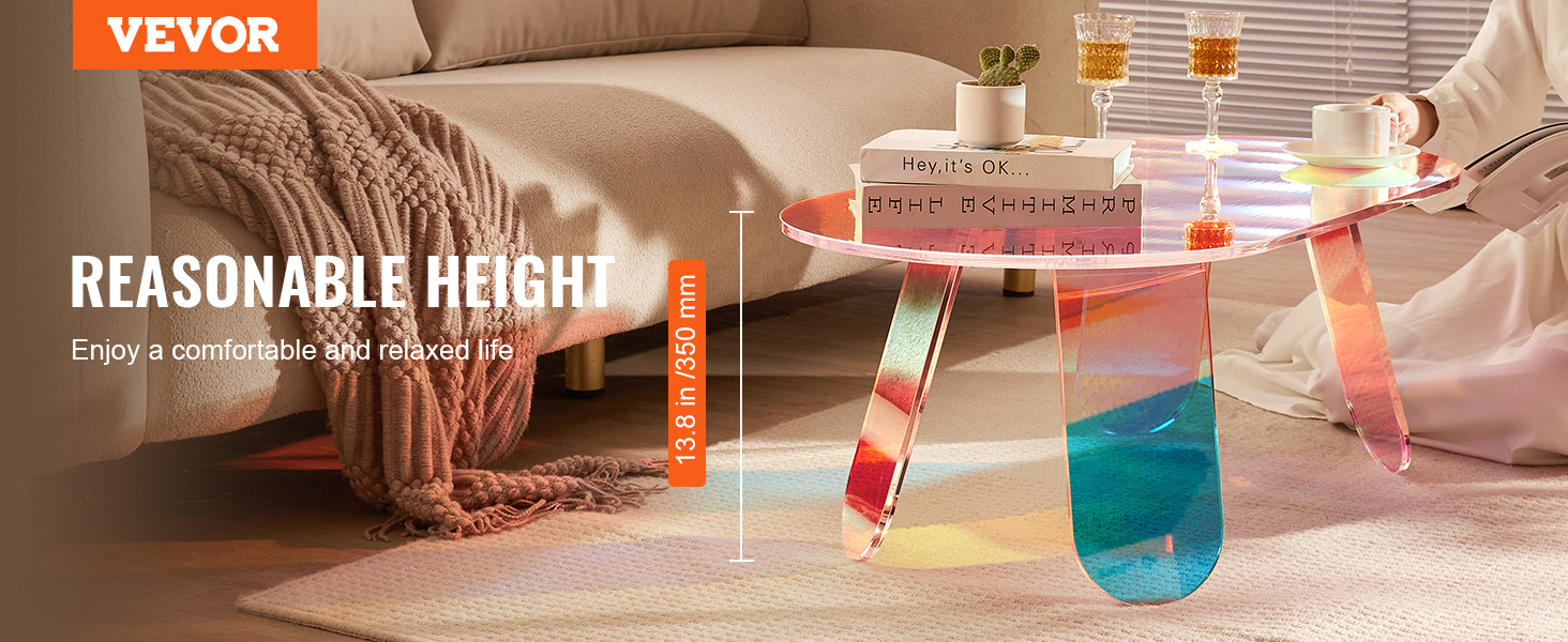 VEVOR acrylic coffee table in living room with books, cups, and comfortable ambiance.
