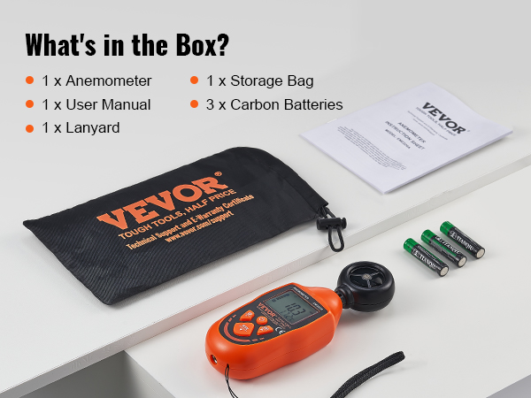 VEVOR handheld anemometer, storage bag, user manual, lanyard, and carbon batteries on a table.