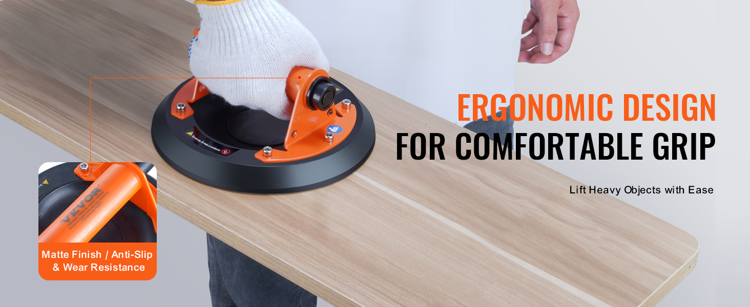 person using an ergonomic VEVOR glass suction cup on a wooden surface, showcasing grip and durability.