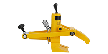 yellow VEVOR bead breaker with hydraulic cylinder and hand crank.