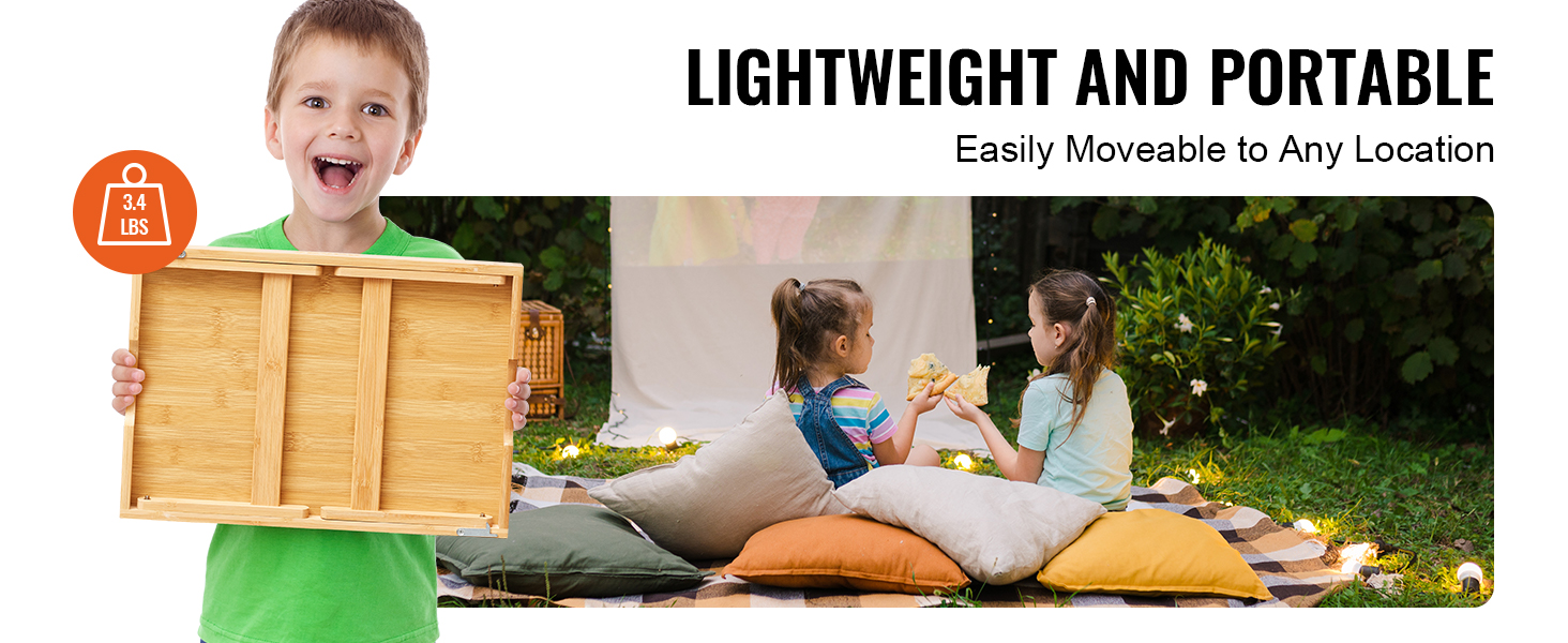 boy holding VEVOR bed tray table, two children sitting on cushions outdoors, text: lightweight and portable.