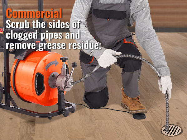 worker using VEVOR drain cleaning machine for commercial pipe maintenance in a clean wooden floor setting.