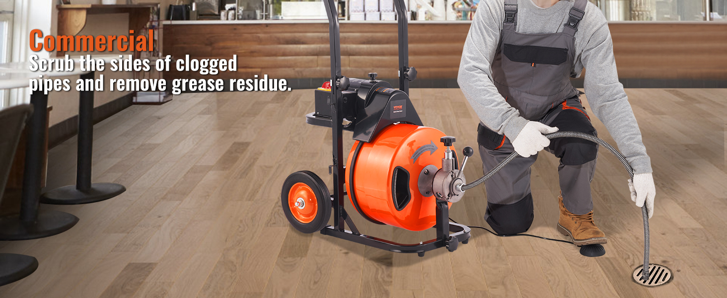 worker using VEVOR drain cleaning machine for commercial pipe maintenance in a clean wooden floor setting.