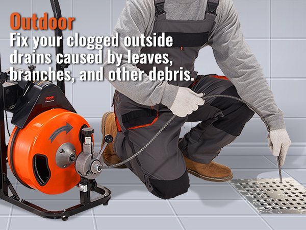 person using VEVOR drain cleaning machine to clear blocked outdoor drain on tiled floor.