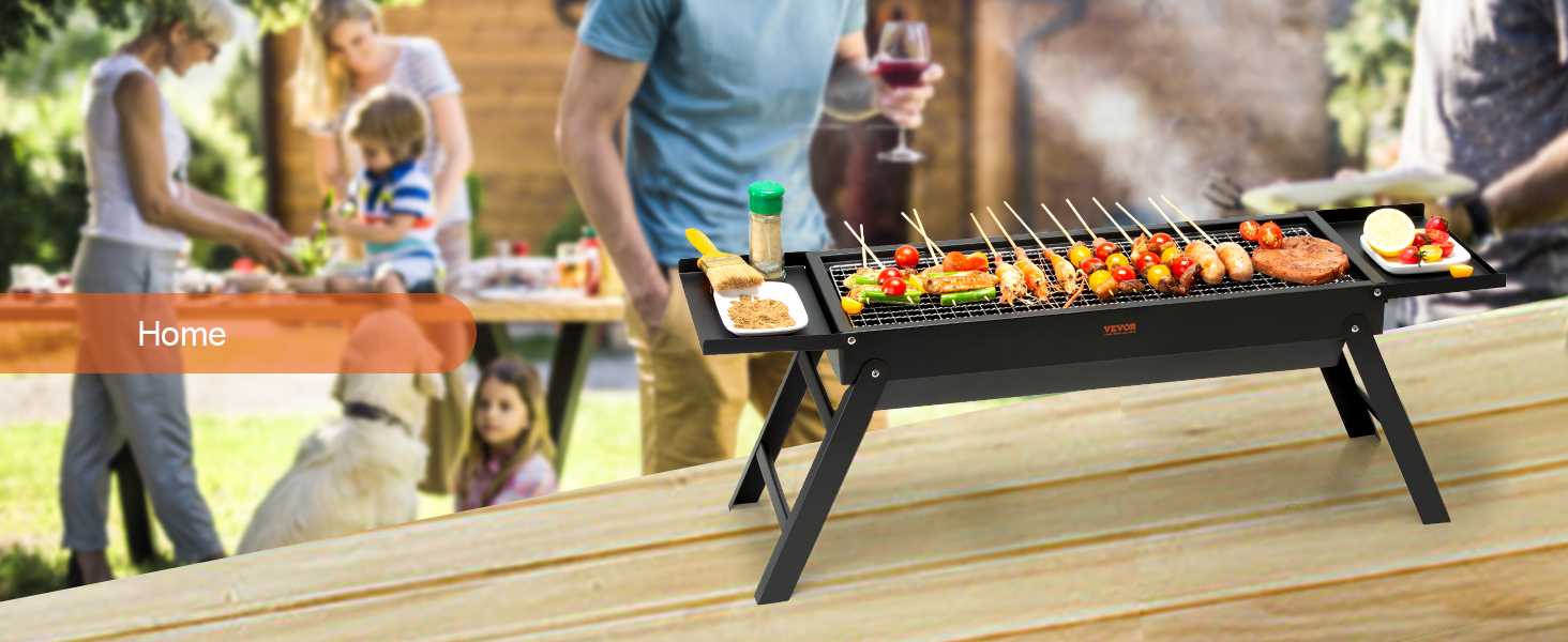 VEVOR portable charcoal grill in use with skewers, surrounded by people at an outdoor gathering.