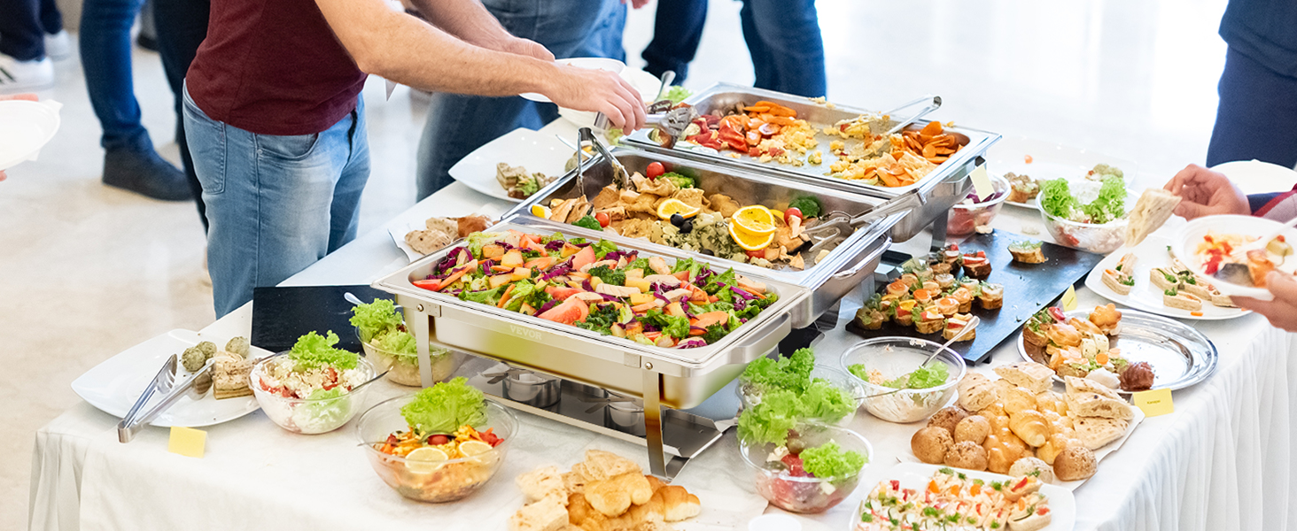buffet setup with a VEVOR chafing dish set filled with colorful vegetables and appetizers.