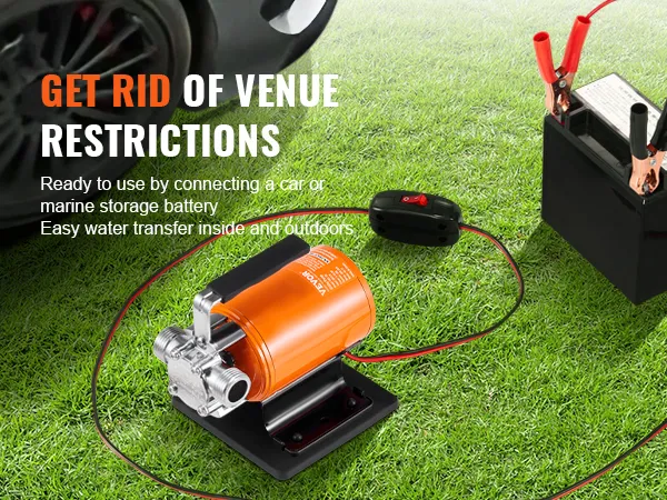 VEVOR water transfer pump connected to a battery on grass, ready for indoor and outdoor use.