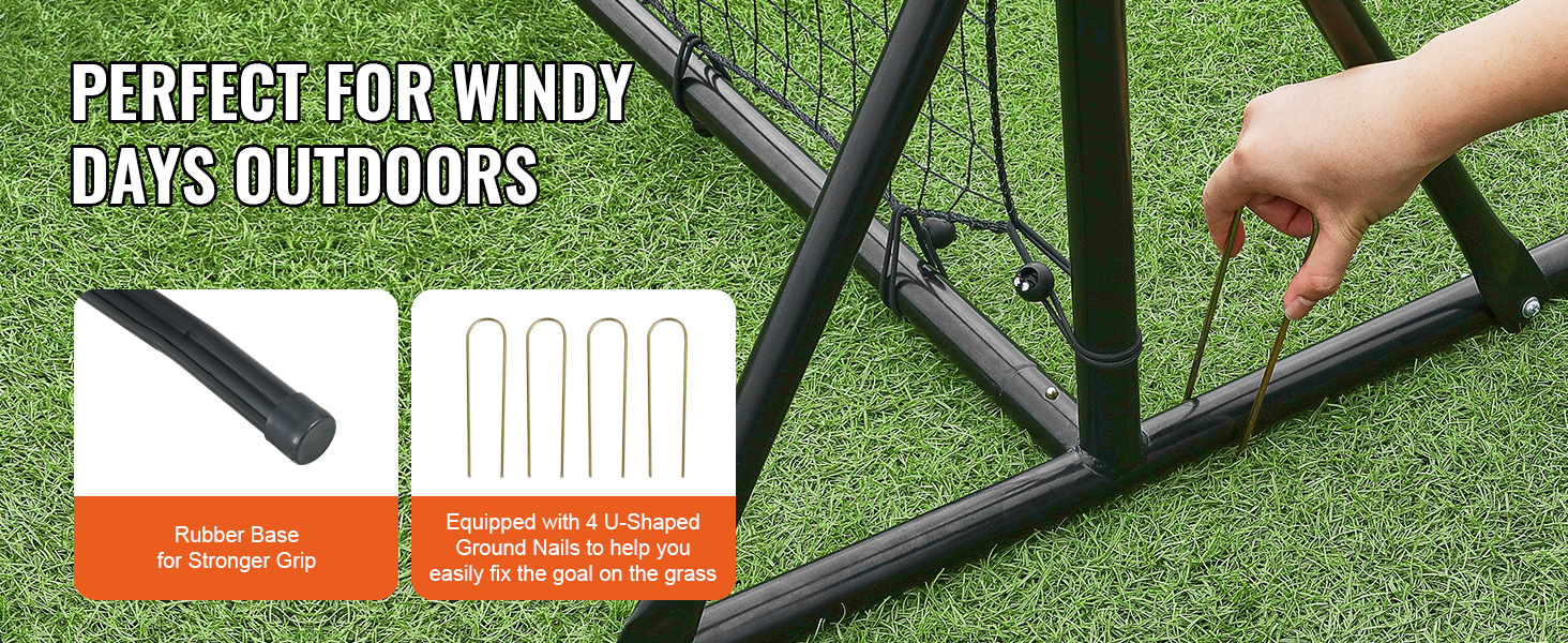 hand securing VEVOR soccer rebounder net with u-shaped ground nails, showing triangular rubber base.