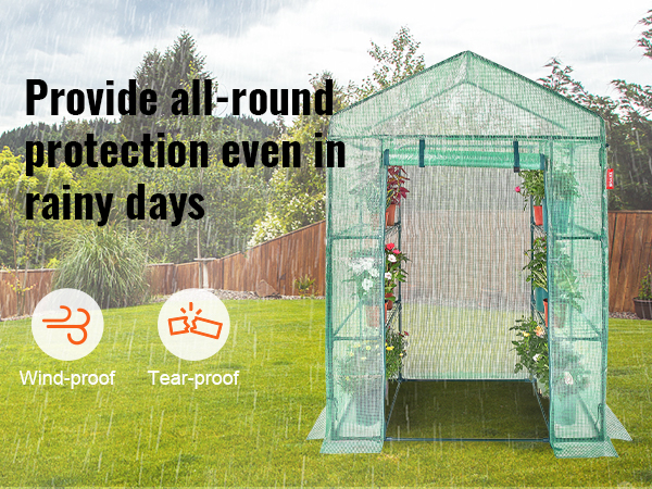 VEVOR walk-in greenhouse offering rain, wind, and tear protection with plants inside during rainfall.