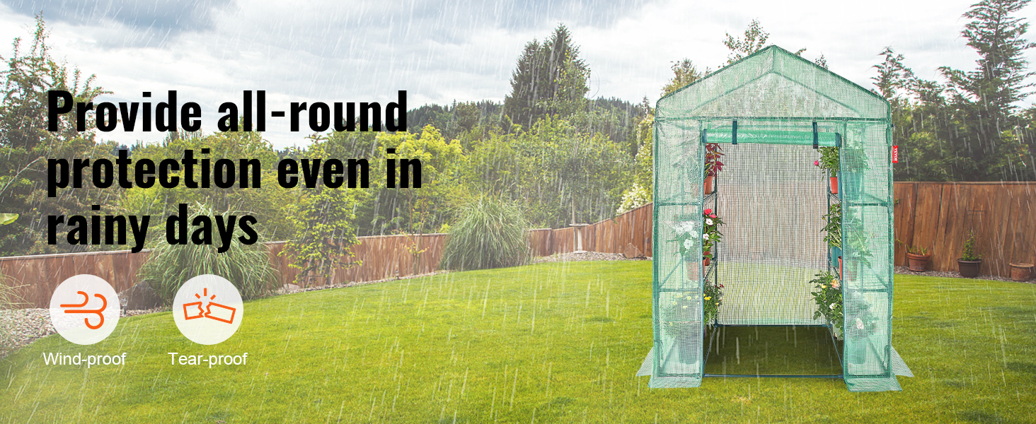 VEVOR walk-in greenhouse offering rain, wind, and tear protection with plants inside during rainfall.