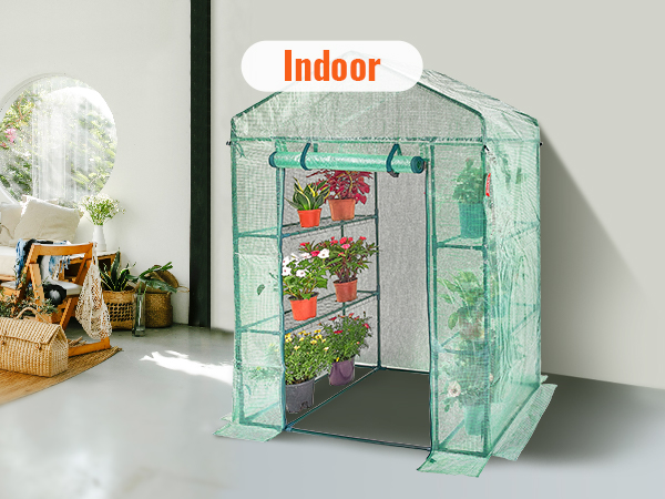 VEVOR walk-in greenhouse situated indoors surrounded by plants, basket, and a cozy chair.