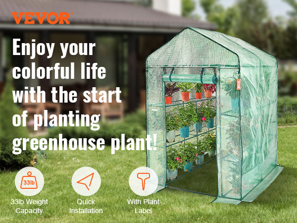 VEVOR walk-in greenhouse with shelves filled with colorful potted plants in a garden setting.