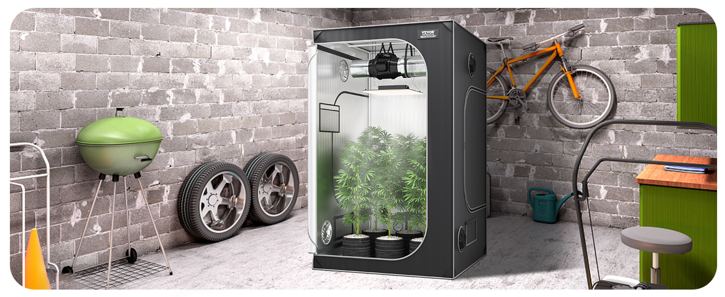 VEVOR grow tent in a garage with plants, green grill, spare tires, orange bike, desk, and chair.