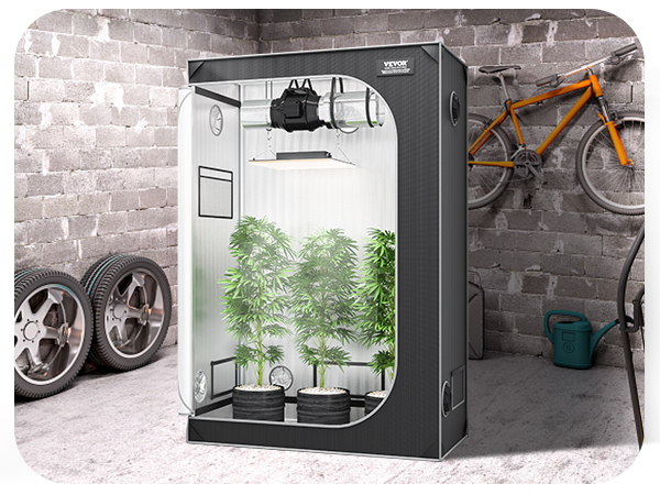 VEVOR выращивает палатку в гараже с растениями внутри, рядом с зеленым грилем, запасными шинами и оранжевым велосипедом.