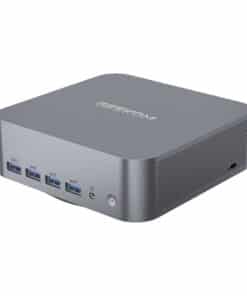 Compact mini PC with Geekom branding, front ports including four USB 3.0, audio jack, and power button; perforated side panel for ventilation on the right.
