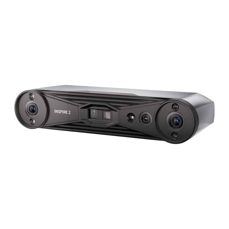Front view of the DJI Inspire 2 dual-camera gimbal system on a black rectangular housing, with two lenses on either end and a center control panel.